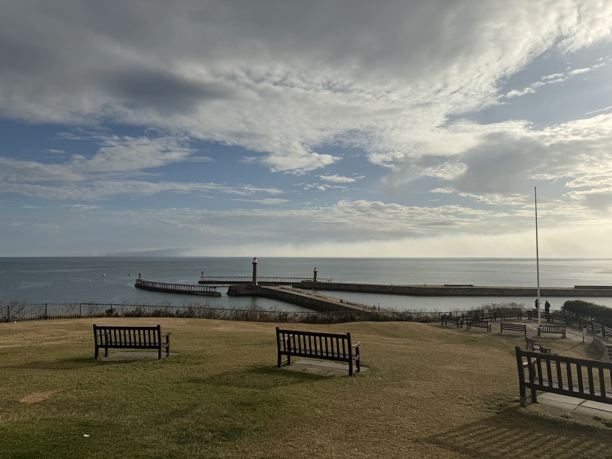 Whitby harbour front with independent cafés and shops, coastal charm