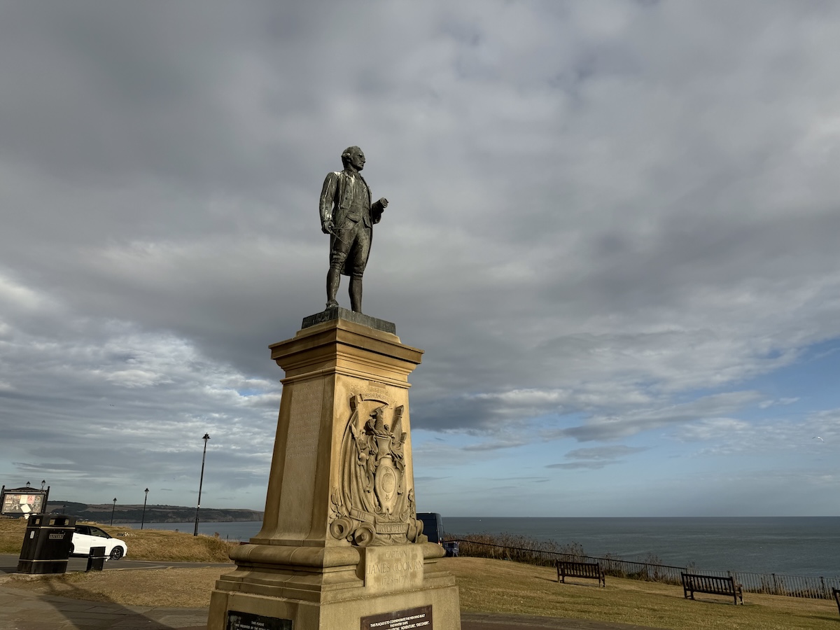 Whitby Abbey ruins overlooking the North Sea, heritage landmark and old town steps